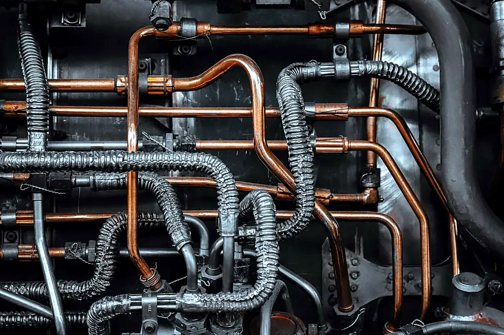 Hydraulic hoses and pipework on a machine