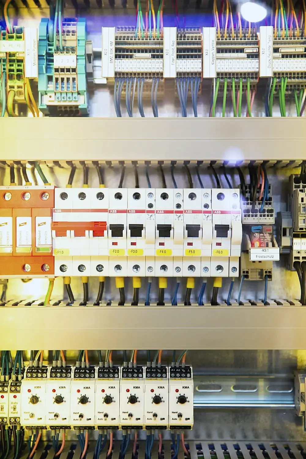 Circuit breakers and terminal wiring inside a control cabinet